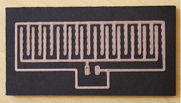 Figure 3. A 3D printed LED nametag circuit on black foam board. 